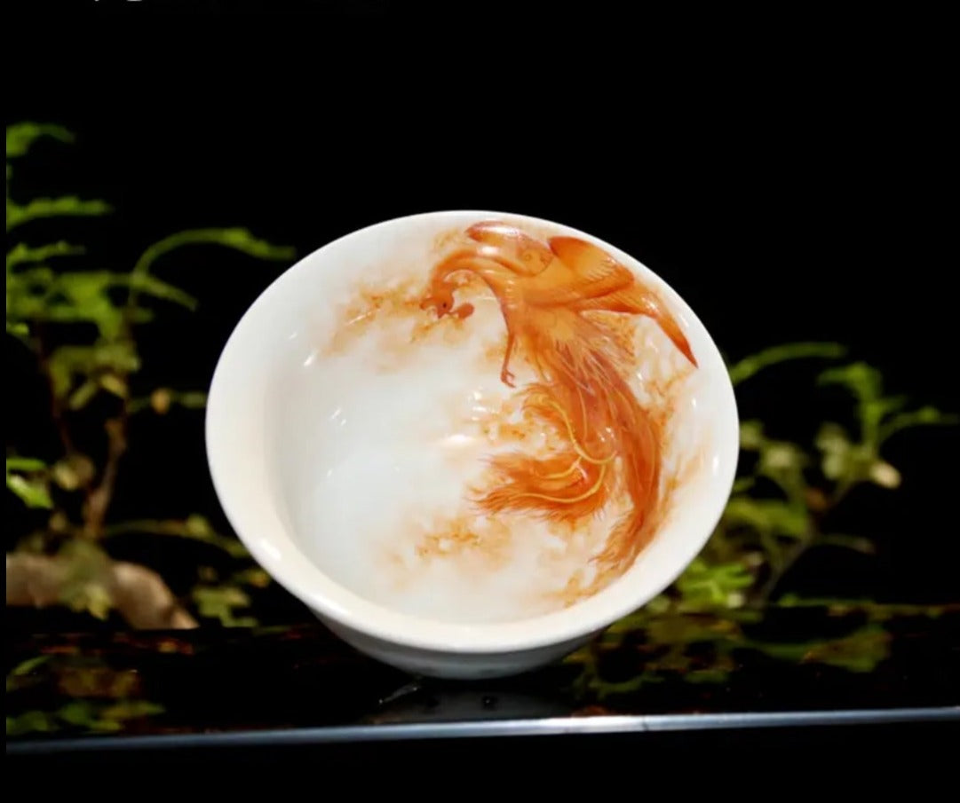 this is a Chinese Jingdezhen alum red dragon phoenix teacup.this is a ceramic teacup