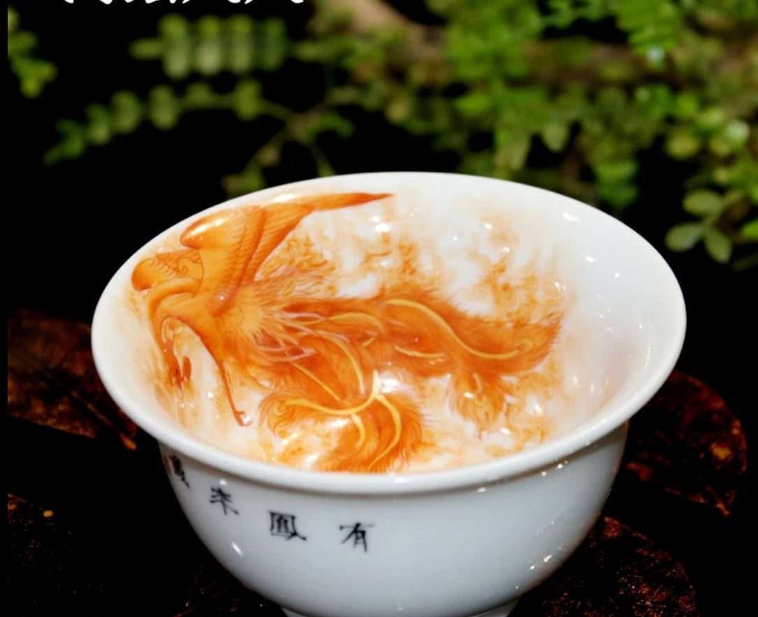 this is a Chinese Jingdezhen alum red dragon phoenix teacup.this is a ceramic teacup