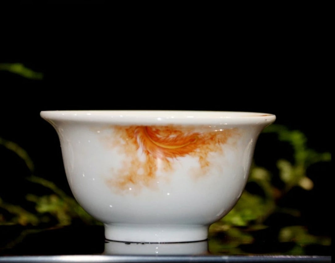 this is a Chinese Jingdezhen alum red dragon phoenix teacup.this is a ceramic teacup