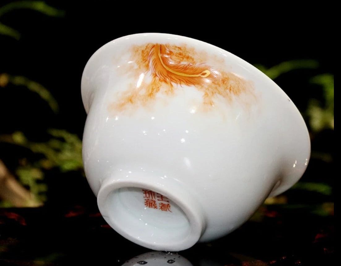 this is a Chinese Jingdezhen alum red dragon phoenix teacup.this is a ceramic teacup