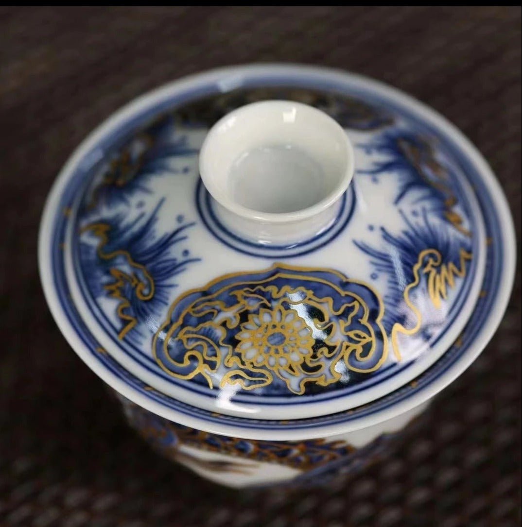 This is a Chinese Jingdezhen blue and white porcelain dragon teapot gaiwan