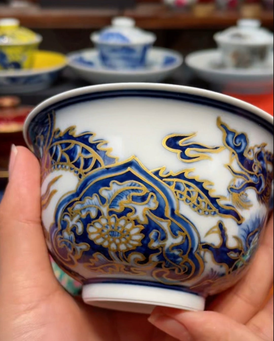 This is a Chinese Jingdezhen blue and white porcelain dragon teapot gaiwan