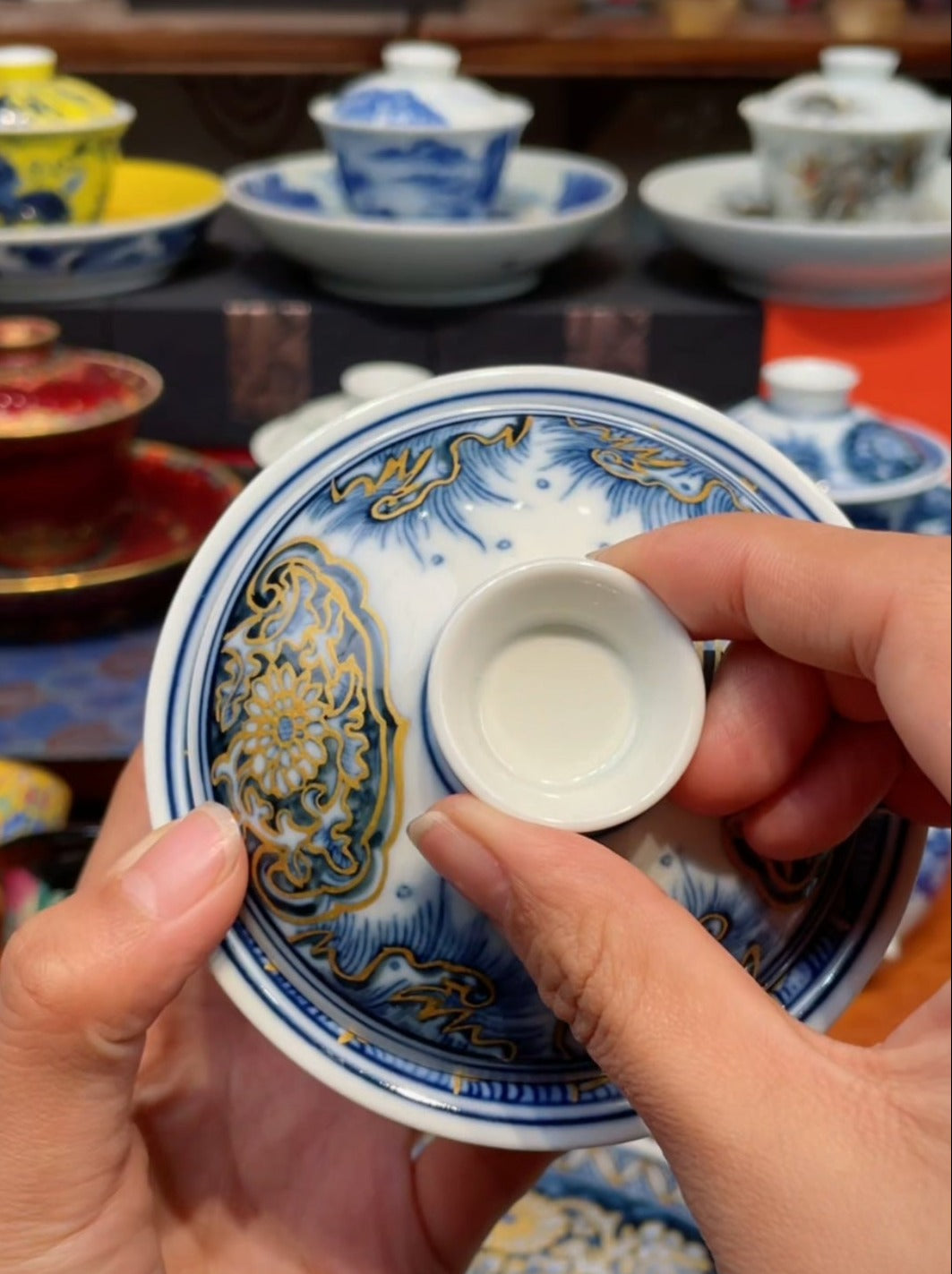 This is a Chinese Jingdezhen blue and white porcelain dragon teapot gaiwan