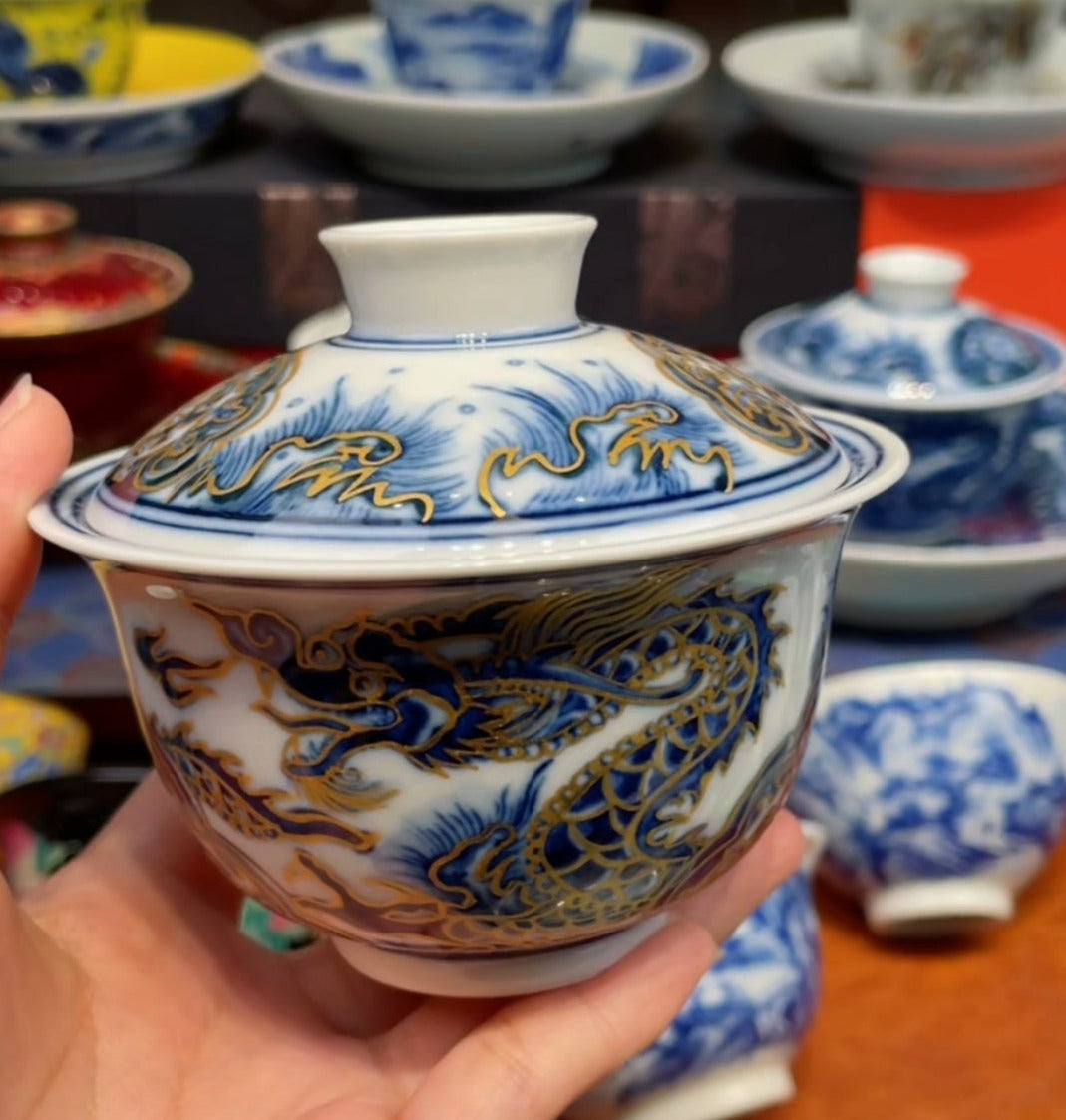 This is a Chinese Jingdezhen blue and white porcelain dragon teapot gaiwan