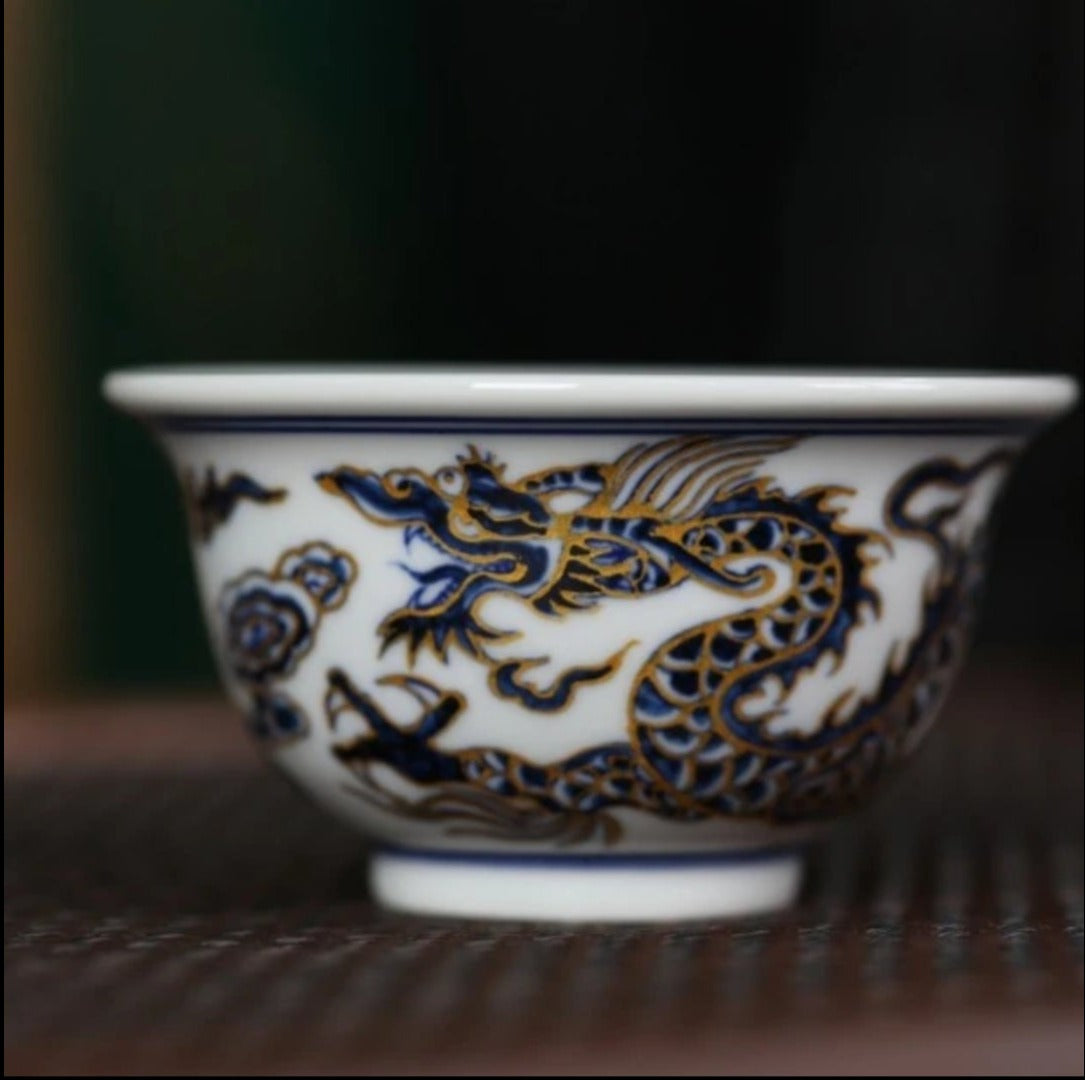 This is a Chinese Jingdezhen blue and white porcelain dragon tea cup