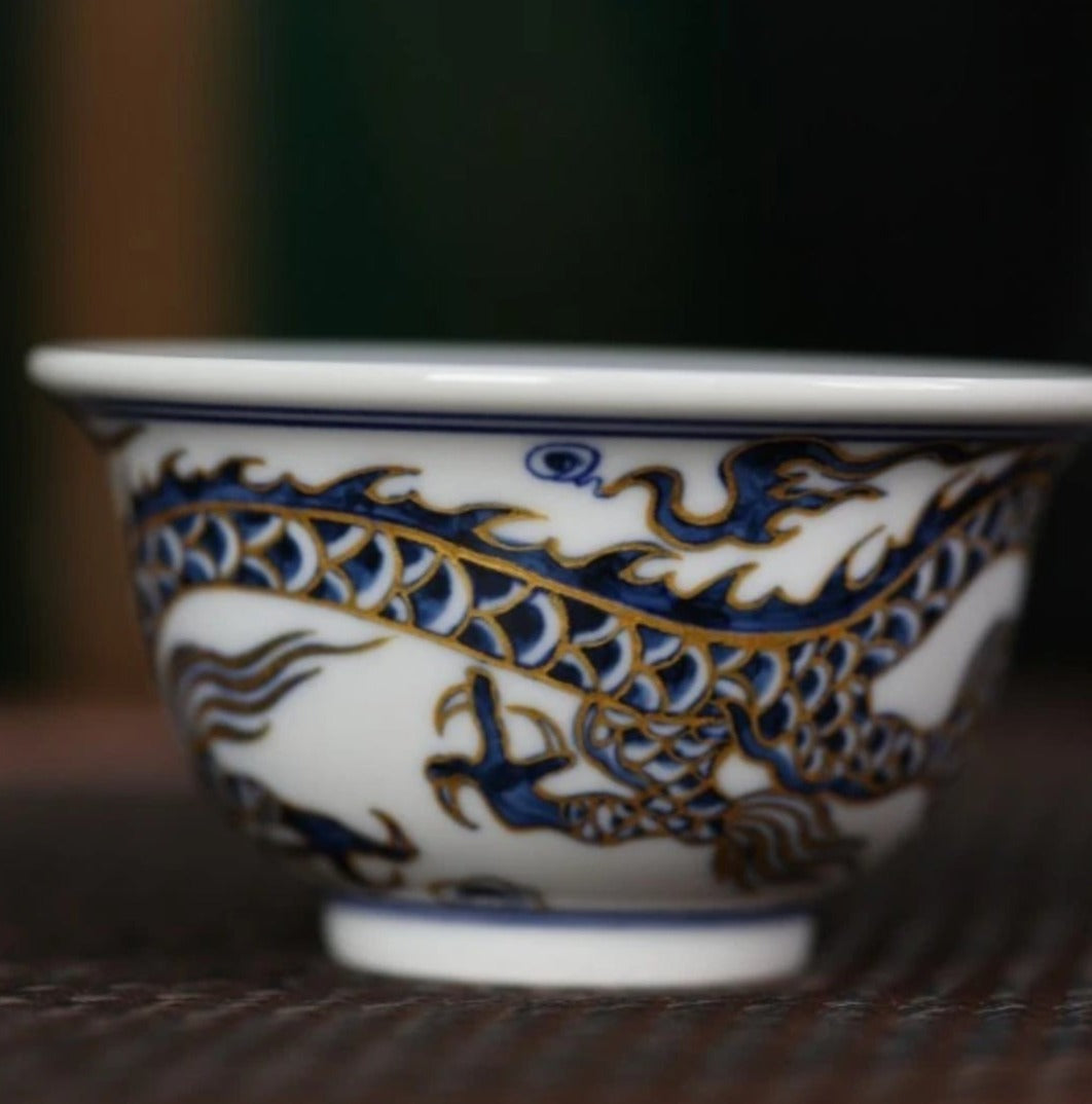 This is a Chinese Jingdezhen blue and white porcelain dragon tea cup