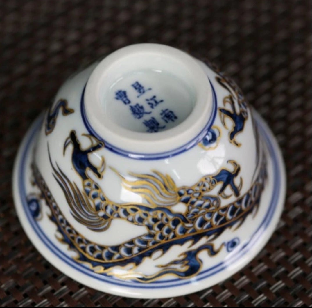 This is a Chinese Jingdezhen blue and white porcelain dragon tea cup