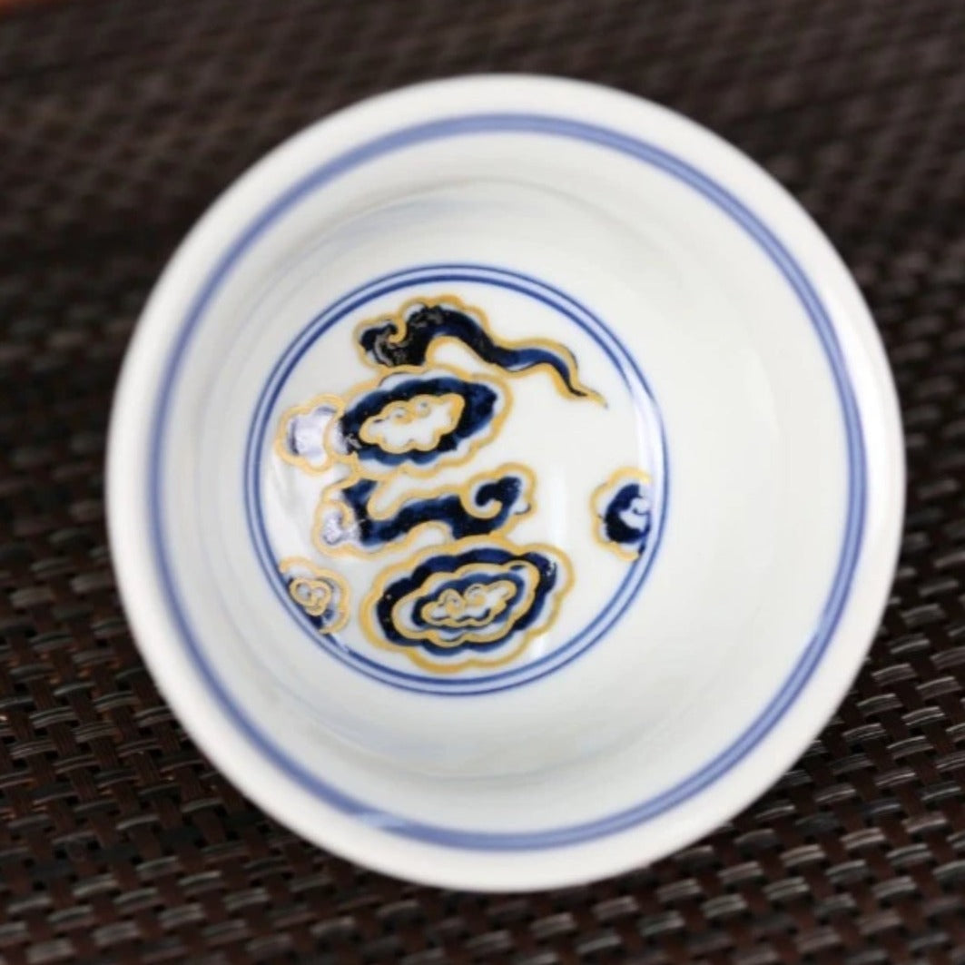 This is a Chinese Jingdezhen blue and white porcelain dragon tea cup