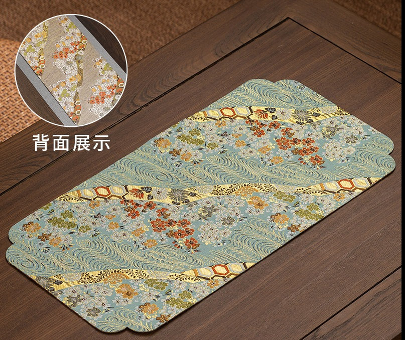 This is a silk brocade tea mat.this is a waterproof table cloth