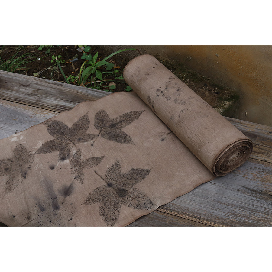 This is a plant-dyed tea mat table cloth