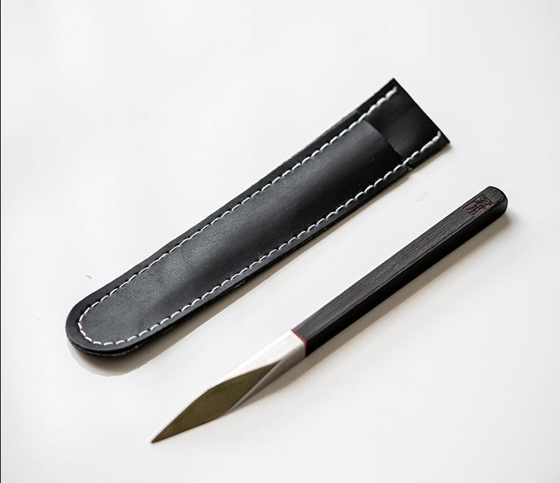 This is a sandalwood puerh cake knife tea knife tea needles