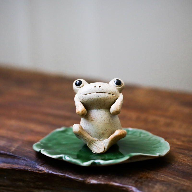 This is a pottery frog teapet