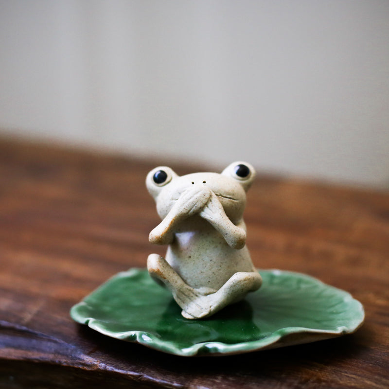 This is a pottery frog teapet