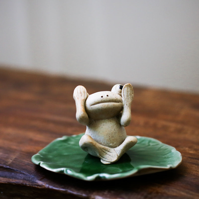 This is a pottery frog teapet