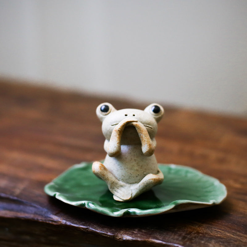 This is a pottery frog teapet