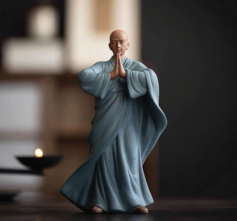 this is a pottery monk sculpture