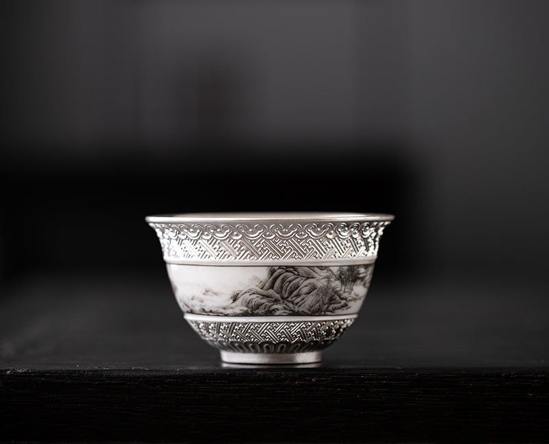 This is a gilted silver ceramic teacup