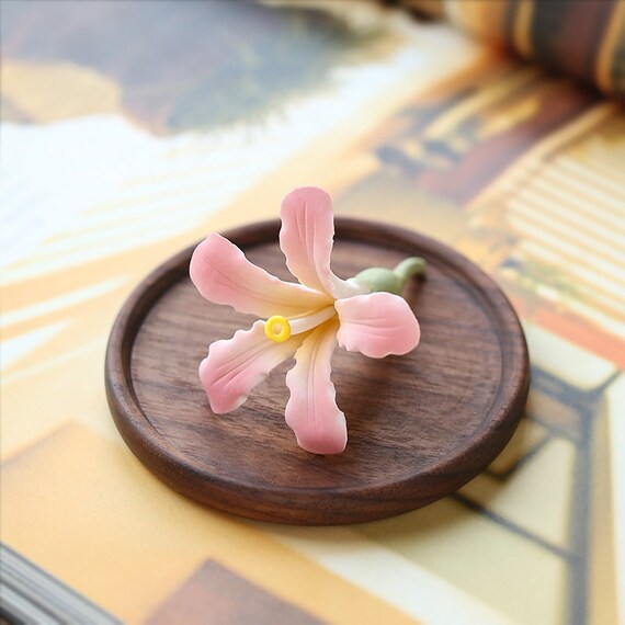 This is a ceramic flower incense holder