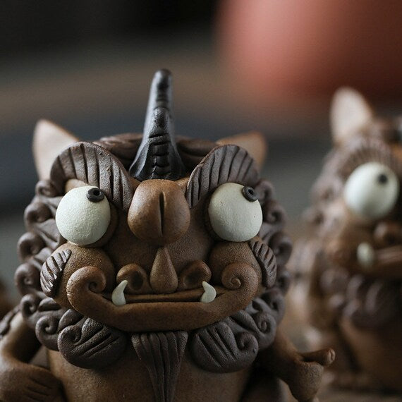 This is a pottery incense holder tea pet