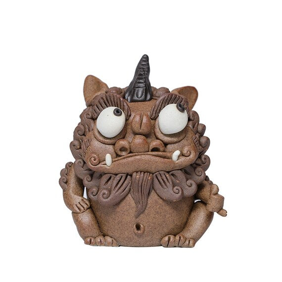 This is a pottery incense holder tea pet