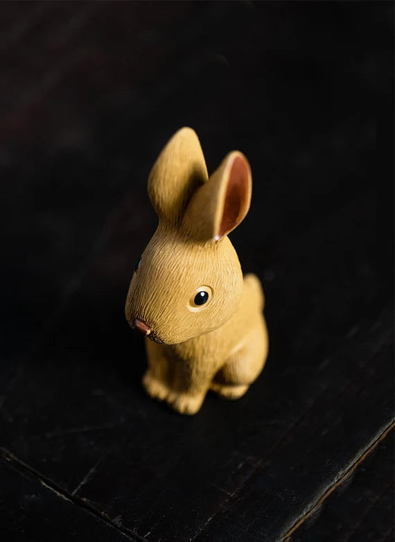 This is a Yixing purple clay rabbit teapet