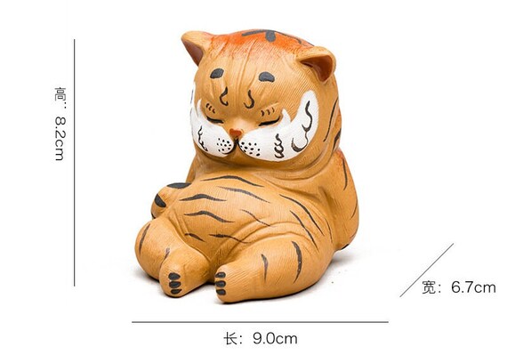 This is a Yixing purple clay tiger teapet