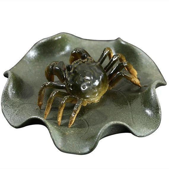 This is a Yixing clay color changing crab teapet