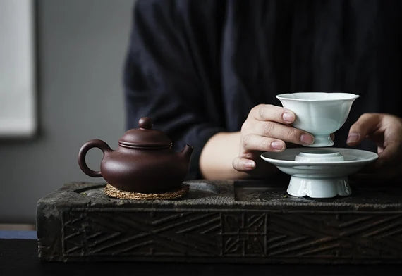 This is a ceramic teacup.this is wood ash glaze teacup