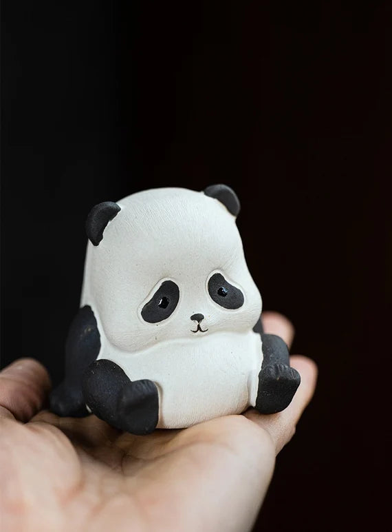 This is a Yixing purple clay panda teapet