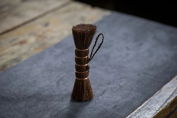 This is a palm fibre tea brush