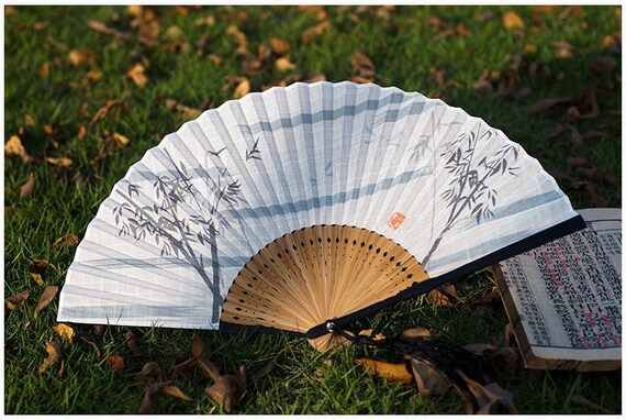 This is a bamboo cotton linen folding fan