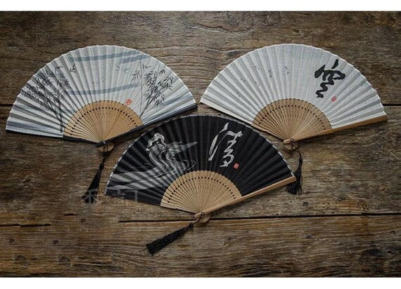 This is a bamboo cotton linen folding fan