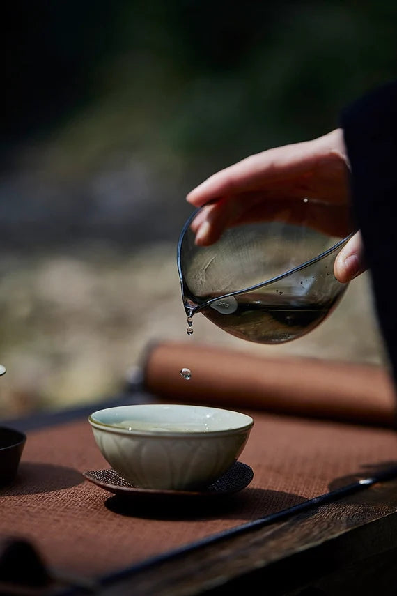 This is a transparent black glass faircup gongdaobei