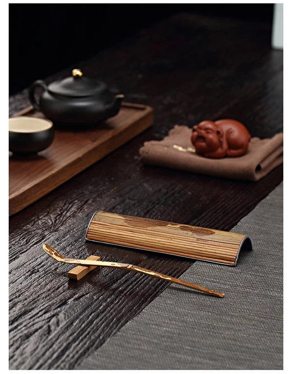 This is a tin bamboo tea scoop