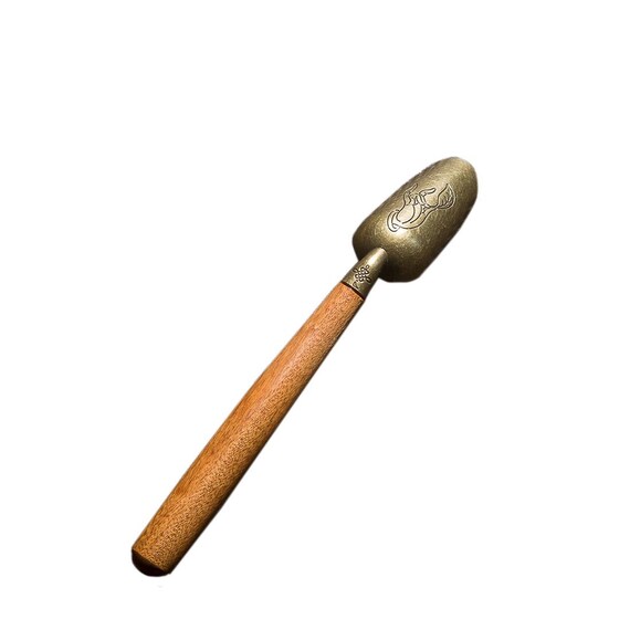 This is a wooden tea scoop