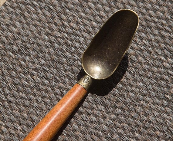 This is a wooden tea scoop