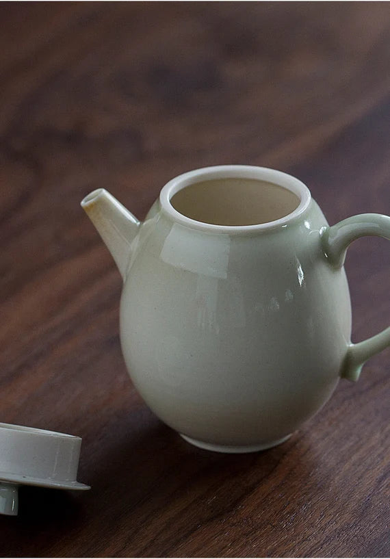 this is a wood ash glazed teapot.this is a ceramic teapot