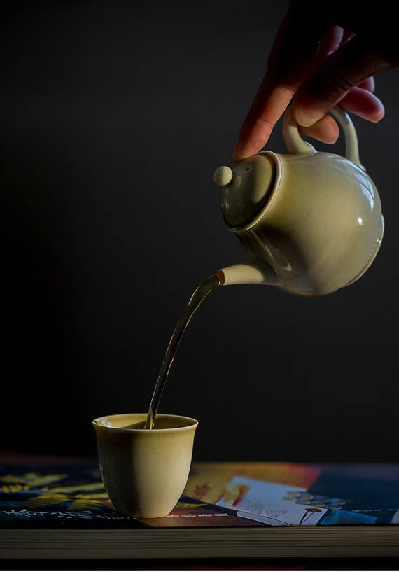 this is a wood ash glazed teapot.this is a ceramic teapot