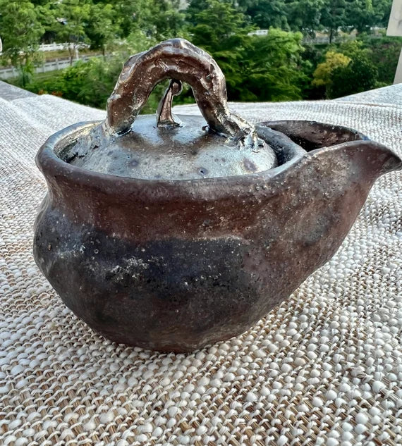 This is a pottery teapot