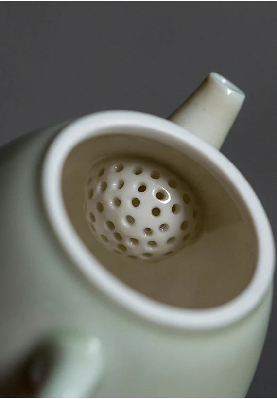 this is a wood ash glazed teapot.this is a ceramic teapot