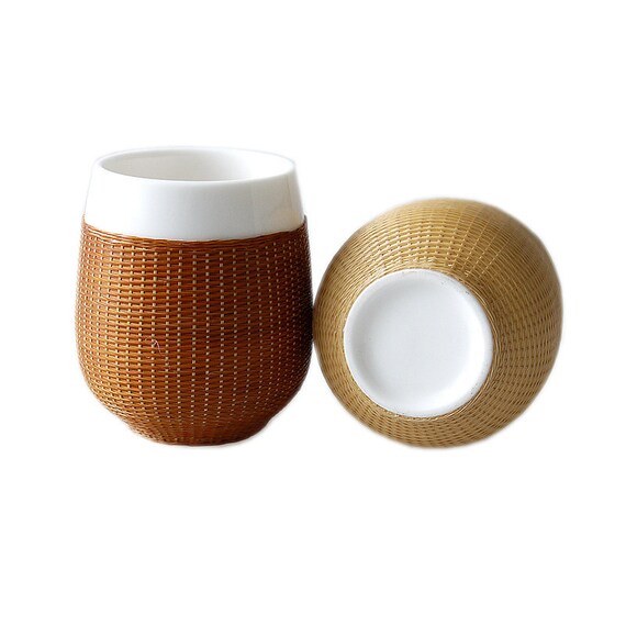 This is a bamboo woven teacup.this is a ceramic teacup