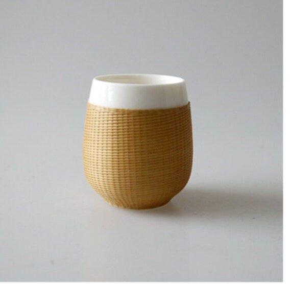 This is a bamboo woven teacup.this is a ceramic teacup