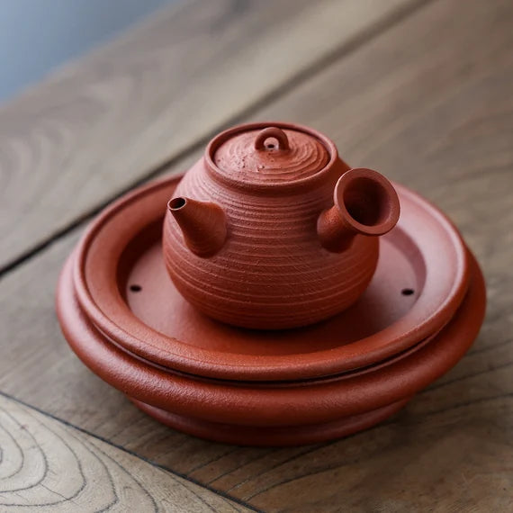 This is a Chaozhou side handle teapot.this is Chaozhou red clay zhuni teapot