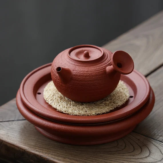 This is a Chaozhou side handle teapot.this is Chaozhou red clay zhuni teapot