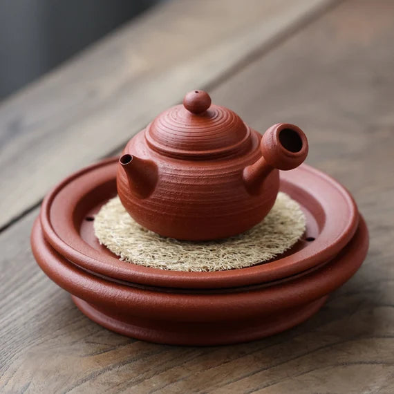 This is a Chaozhou side handle teapot.this is Chaozhou red clay zhuni teapot