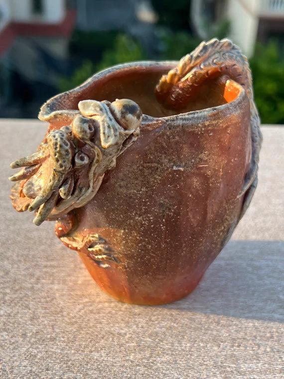 This is a woodfired pottery dragon faircup gongdaobei