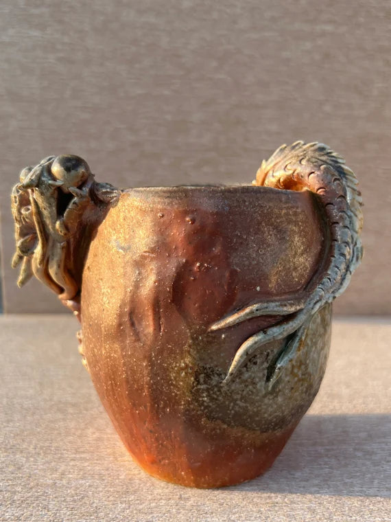 This is a woodfired pottery dragon faircup gongdaobei