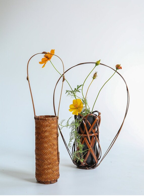 This is a bamboo weaving vase flower utensil