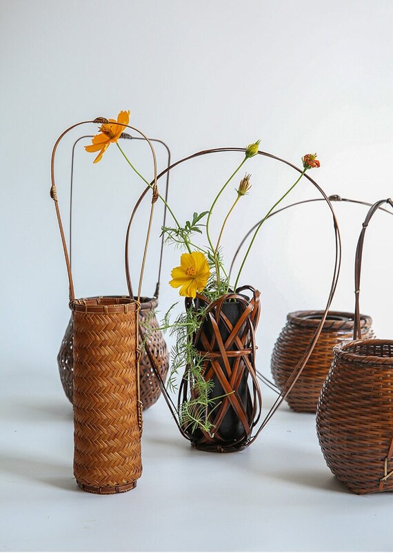 This is a bamboo weaving vase flower utensil