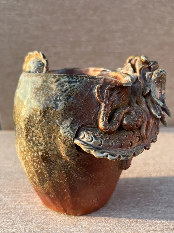 This is a woodfired pottery dragon faircup gongdaobei